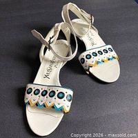 Top view of both sandals showing appliqué decoration and ankle straps