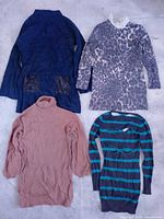 Four dresses: navy textured, grey leopard, taupe turtleneck, striped teal/charcoal