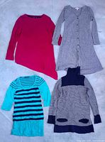 Four dresses: magenta asymmetrical hem, heather grey button-front, turquoise/navy striped, grey/navy colour-block