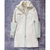 Full front view of white wool jacket with leather cuffs and fur collar