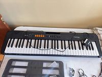 Full keyboard on table with adapter visible