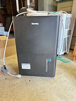 Front view showing brand logo, water tank window, power cord