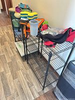 Both shelving units with some personal items on top shelves