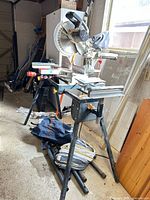 Craftsman sliding mitre saw mounted on Mastercraft stand, side view