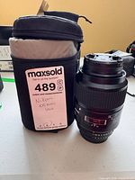 Lens in case with lot tag visible