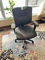 Front view of adjustable office chair on clear mat