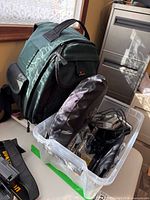 Backpack and bin containing accessories