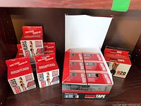 Group shot of RockFloss and RockTape boxes on shelf