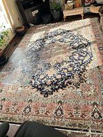 Full view of patterned acrylic rug on floor