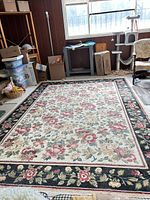 Full view of rug in room showing overall pattern and size