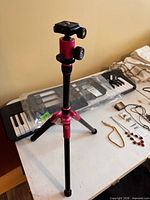 Full view of Selens red tabletop tripod with extended legs