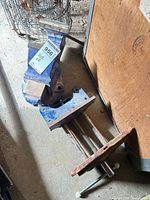 Both vices lying on garage floor, overall view