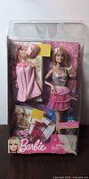Front of boxed Barbie Spa to Fab doll showing doll, robe, mask accessory and damaged lower box edge