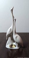 Front view of Capodimonte white porcelain two-crane figurine with gold accents