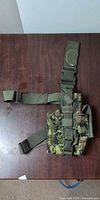 Full view of digital woodland camo drop leg holster laid flat showing overall design and straps
