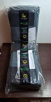 Two sealed Drive Auto Products seat protector packs stacked