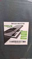 Front label of Drive Auto Products car seat protector showing features