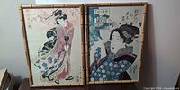 Two framed Japanese ukiyo-e style prints side by side