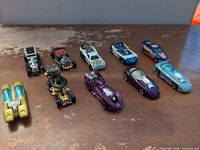All ten Hot Wheels cars front view on table