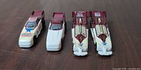 Four Hot Wheels dragsters lined up front view showing overall condition