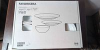 Closed box showing IKEA Favorisera branding and line drawing of set