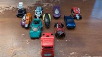 Group shot of all ten die-cast cars on tabletop