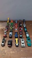 All 25 die-cast cars arranged in five rows on tabletop