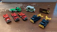 All eight die-cast vehicles on tabletop