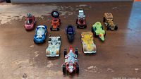 All ten die-cast vehicles arranged in two rows on tabletop