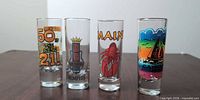 Front view showing all four shot glasses and printed designs