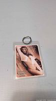 Front view of laminated keychain showing Yasmine Blake pinup image