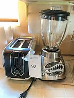 Toaster and blender side by side on countertop