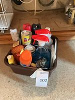 Entire tote with assorted cleaning supplies visible