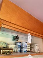 Shelf view showing all six tins together