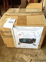 Sealed DigitNow product box with printed product image and spec sheet visible