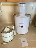 Jack LaLanne Power Juicer and Braun citrus juicer on countertop
