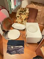 Group shot showing microwave, bakeware, plates, utensils, trays and bowl