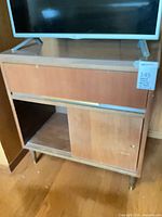 Front view of console with drawer and sliding door