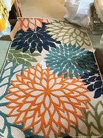 Top view of entire multicolor floral area rug