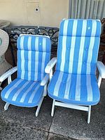 Two Kettler patio chairs side by side showing full view, cushions and frames