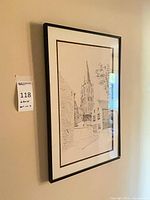 Full view of one framed print on wall