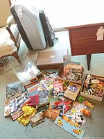 Overall view of matchbooks, postcards, bandanas, Snoopy sign and wooden box