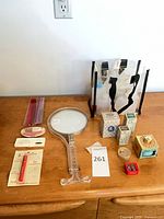Overall lot showing mirror, combs, makeup items, Avon boxes