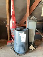 Group shot of Hoover stick vacuum, Winix air purifier, Lasko tower heater