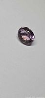 Oval faceted ametrine front view