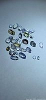 Group of approx 30 faceted tanzanite stones assorted cuts