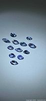 All 11 Tanzanite gemstones laid out