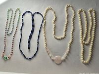 Four necklaces overview on white background