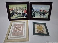 All four framed artworks laid out, showing imagery and frames