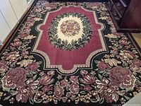 Full view of rug on floor showing overall pattern and size